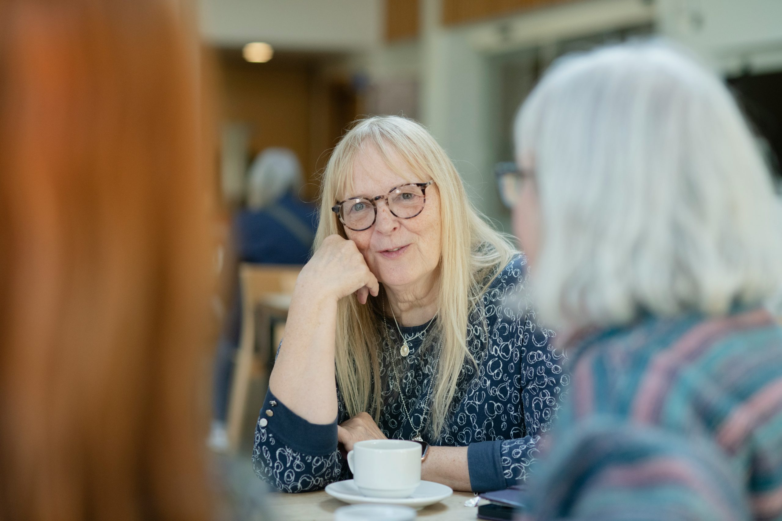 retired woman drinking tea